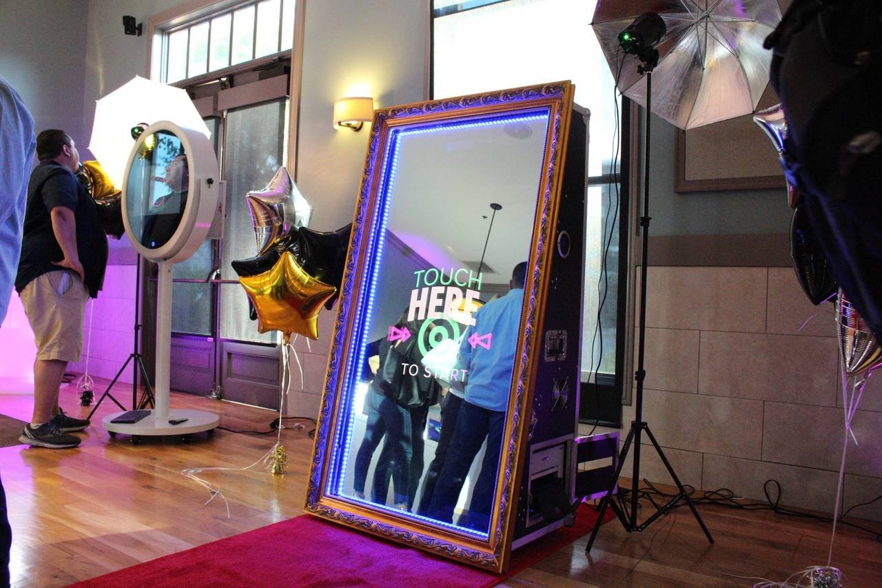 Guests using a magic mirror booth